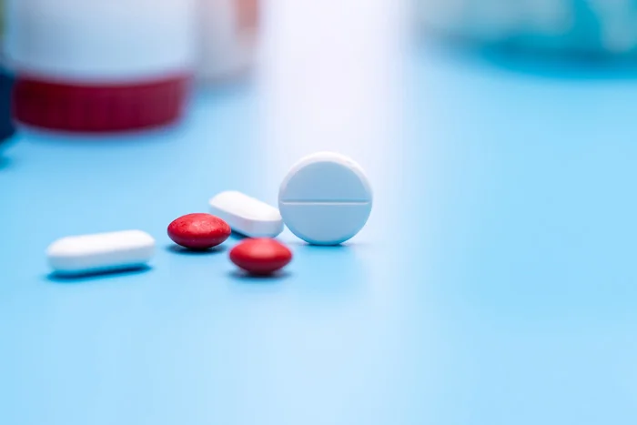 Visual representing drugs on a table with blue background